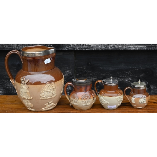 434 - # A Victorian Royal Doulton stoneware harvest jug with silver rim, to/w a mustard pot with silver co... 