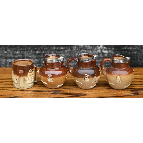 434 - # A Victorian Royal Doulton stoneware harvest jug with silver rim, to/w a mustard pot with silver co... 