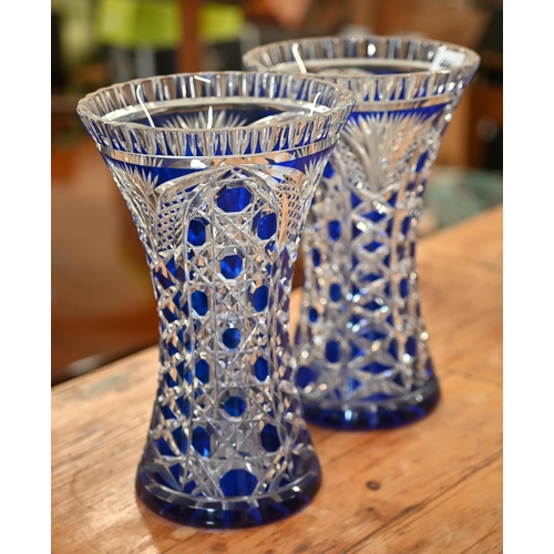 441 - A pair of blue flash glass vases hung with prism lustres, 32 cm high to/w a pair of waisted vases an... 