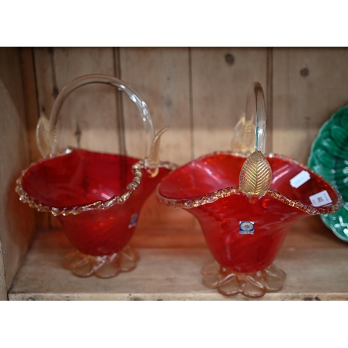 443 - A pair of Murano red and gilt glass baskets, 23 cm high