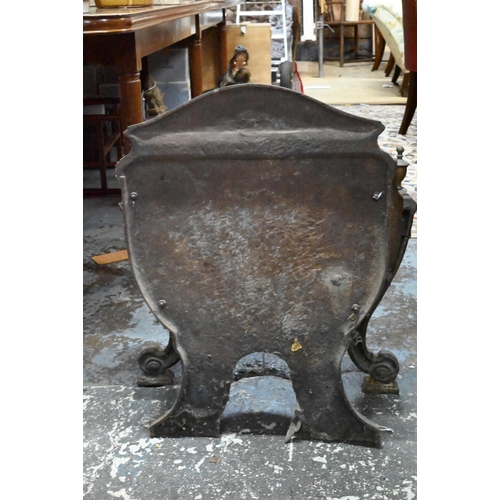 884 - An antique cast iron and brass urn finial Adam style fire basket, with bow front raised on scroll fr... 