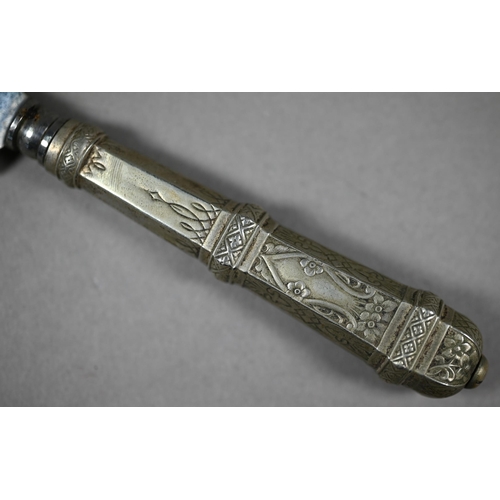 1002 - A Gaucho boot-knife with 15 cm stainless steel blade on engraved white metal hilt and foliate-chased... 