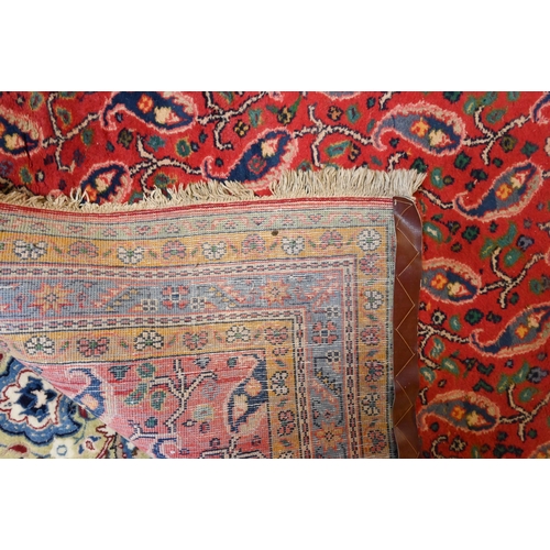 730 - A mid-century Persian Hamadan rug, the stylised floral design on mid-red ground, 240 cm x 150 cm