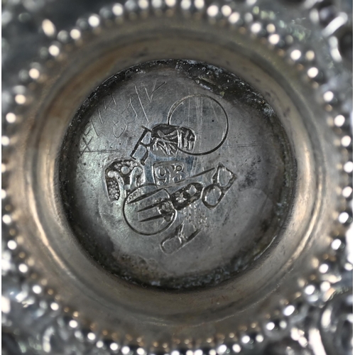 106 - A 19th Century silver bowl with embossed decoration and stemmed foot, London import 1897, 4.1oz, 12c... 