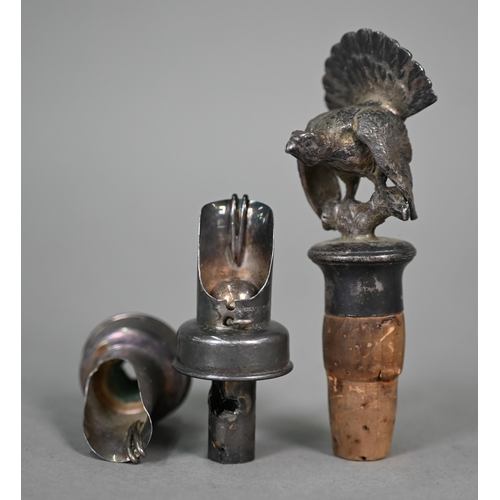 11 - Two silver-topped glass scent bottles and a bottle stopper surmounted by a silver capercaillie, Lond... 