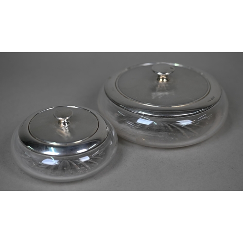110 - An engine-turned silver six-piece toilet set, comprising two powder bowls with mirrored lids, three ... 