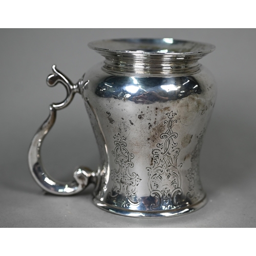 116 - A George II silver baluster mug with scroll handle and moulded foot-rim (later engraved decoration),... 
