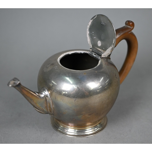 117 - A silver bullet-shaped bachelor teapot in the early Georgian manner, with fruitwood handle, Tessiers... 