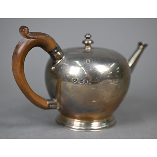 117 - A silver bullet-shaped bachelor teapot in the early Georgian manner, with fruitwood handle, Tessiers... 