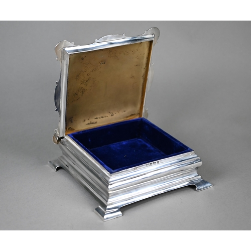 127 - An Edwardian silver jewellery box of ogee form, with hinged lid to gilt and velvet interior, on brac... 