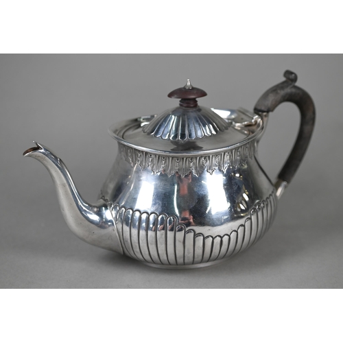 128 - A Victorian silver bachelor teapot of oval squat baluster form with foliate-engraved rim and shallow... 
