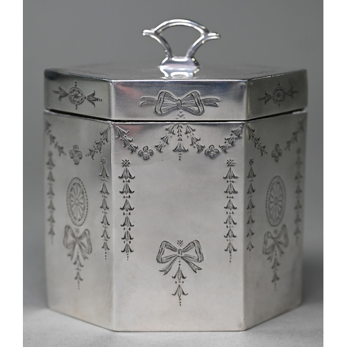 139 - A late Victorian/Edwardian Sheraton Revival silver tea caddy of elongated octagonal form with engrav... 