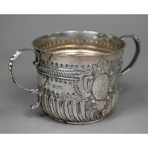 144 - A late Victorian silver porringer in the 17th Century manner, with twin scroll handles and embossed ... 