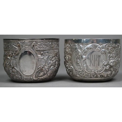 145 - Two late Victorian silver sugar basins, richly embossed and chased in the Indian taste, - both Londo... 