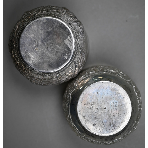 145 - Two late Victorian silver sugar basins, richly embossed and chased in the Indian taste, - both Londo... 