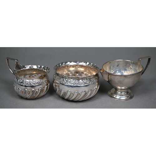 149 - A Victorian embossed and chased silver cream and sugar pair, Josiah Williams & Co., London 1890,... 