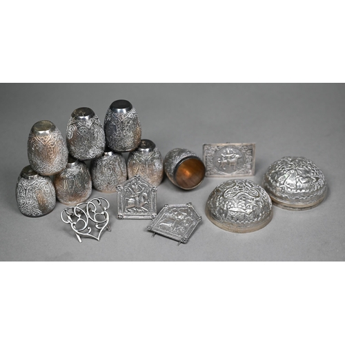 150 - A set of eight Indian white metal small ovoid beakers, richly embossed with foliate cartouches, 4.2c... 