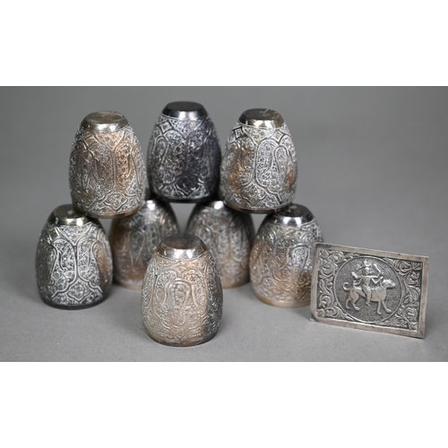 150 - A set of eight Indian white metal small ovoid beakers, richly embossed with foliate cartouches, 4.2c... 