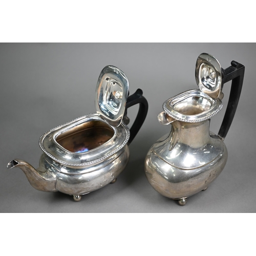 153 - A silver four-piece tea service with gadrooned rims and ball feet, composite mounts, engraved with t... 