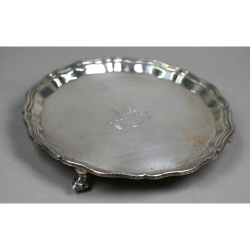154 - A silver letter salver in the Georgian manner, with moulded rim and three scroll feet, engraved with... 