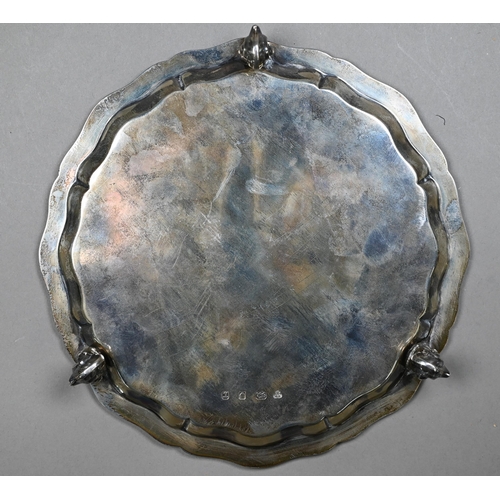 154 - A silver letter salver in the Georgian manner, with moulded rim and three scroll feet, engraved with... 