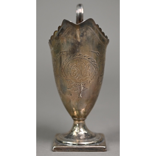 156 - A George III Adam-style helmet cream jug with cut rim and scroll handle, engraved decoration and ste... 