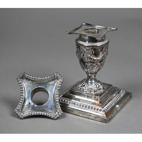 158 - A pair of late Victorian loaded silver Adam Revival short candlesticks of urn form, embossed with sw... 