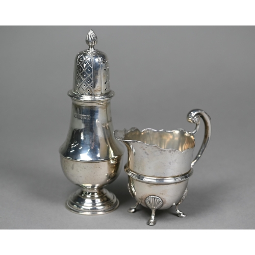 162 - A late Victorian silver helmet-shaped cream jug in the Georgian manner, with scroll handle and hoof ... 