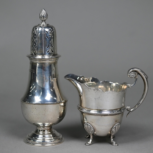 162 - A late Victorian silver helmet-shaped cream jug in the Georgian manner, with scroll handle and hoof ... 