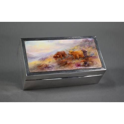 164 - A silver cigarette box, the engine-turned cover inset with a ceramic plaque painted with Highland ca... 