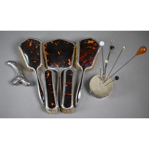 17 - A five-piece silver and tortoiseshell brush set with hand-mirror, to/w a silver-mounted pincushion w... 