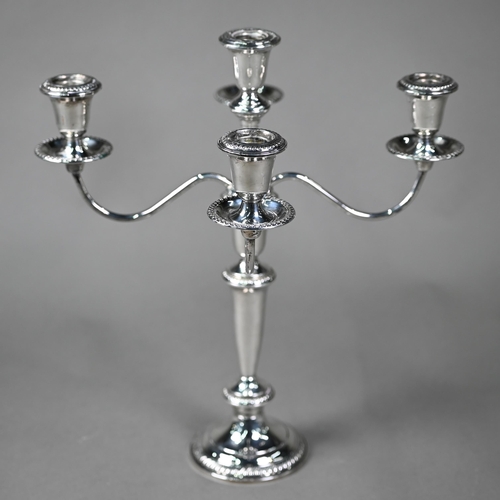 173 - A US weighted Sterling four branch candelabrum with five sconces, the top unscrewing to leave a simp... 