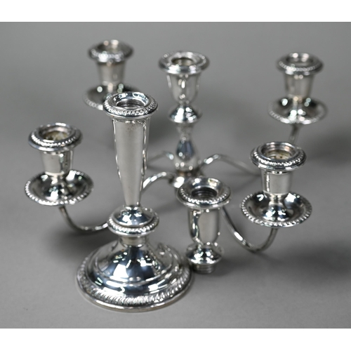 173 - A US weighted Sterling four branch candelabrum with five sconces, the top unscrewing to leave a simp... 