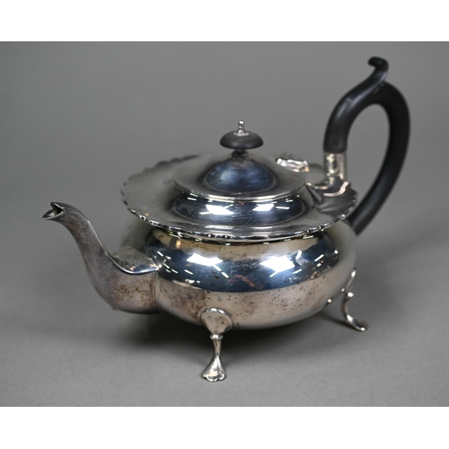 175 - A heavy quality silver three-piece tea service of compressed melon form with shaped rims, pad feet a... 