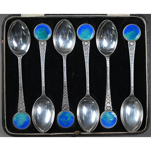 179 - A cased set of six silver teaspoons with opalescent enamel roundel finials and stylised foliate stem... 