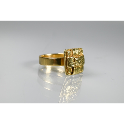 206 - An 18ct yellow gold ring with square 'cross' motif, 1.2 x 1.2cm, size L 1/2, approx 10g