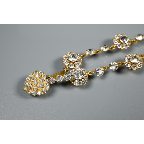 209 - A vintage necklace formed of alternate white paste clusters and single pastes, closed back settings ... 