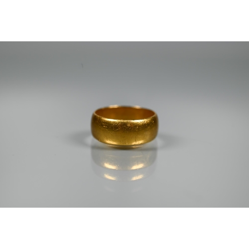 211 - A 22ct yellow gold wide band, size P, approx 9.2g