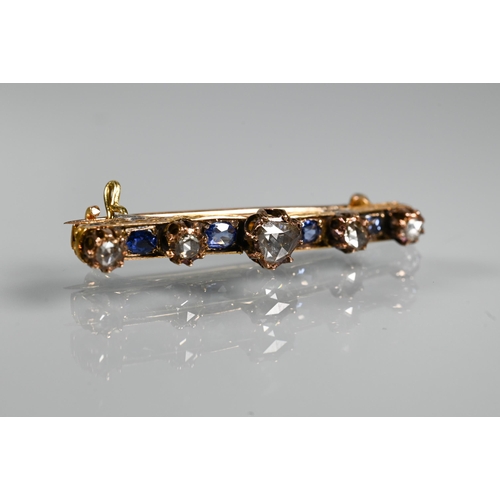 217 - An antique sapphire and diamond bar brooch with four cushion shaped sapphires and five rose cut diam... 