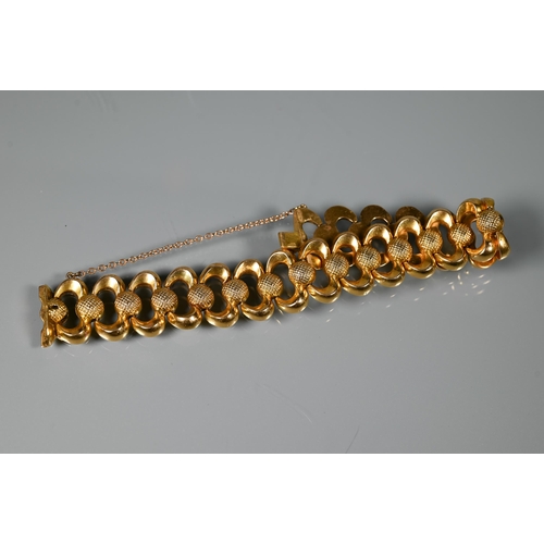 224 - A Continental open linked bracelet with concealed clasp and safety chain attached, yellow metal stam... 