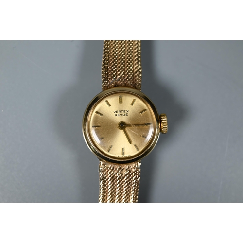 225 - A lady's Vertex Revue 9ct yellow gold wristwatch with pale gold dial, baton numerals and mesh strap,... 