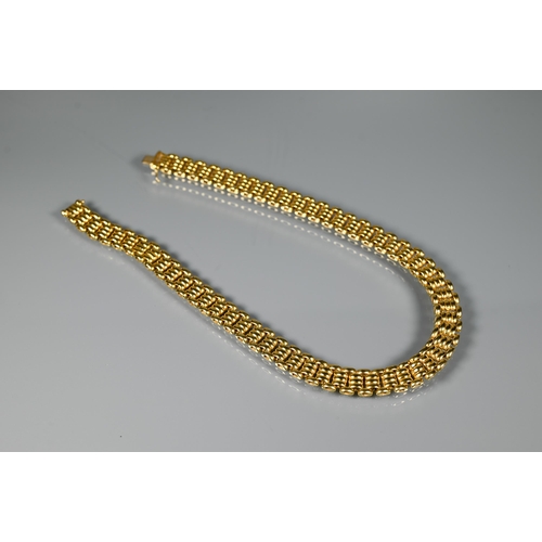 226 - A yellow metal choker/necklace formed of brick links, concealed clasp, stamped 750, approx 65.1g, 40... 