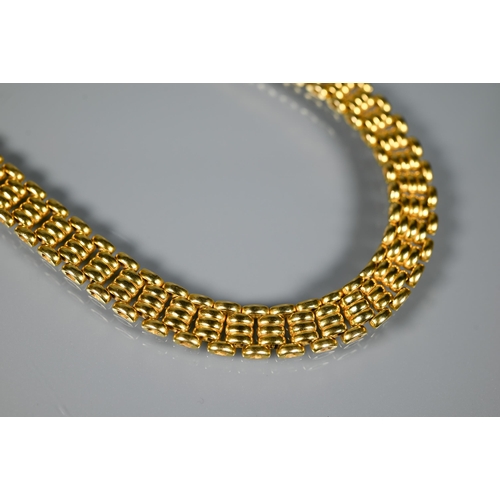 226 - A yellow metal choker/necklace formed of brick links, concealed clasp, stamped 750, approx 65.1g, 40... 