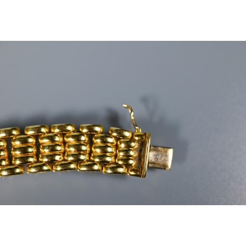 226 - A yellow metal choker/necklace formed of brick links, concealed clasp, stamped 750, approx 65.1g, 40... 