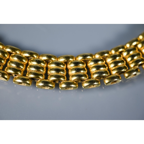 226 - A yellow metal choker/necklace formed of brick links, concealed clasp, stamped 750, approx 65.1g, 40... 