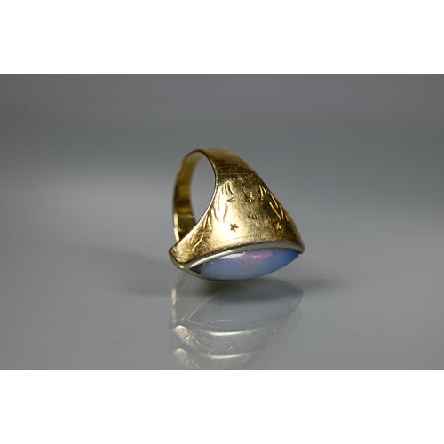 230 - A contemporary style ring with closed back elliptical moonstone (rubbed) in yellow metal setting sta... 