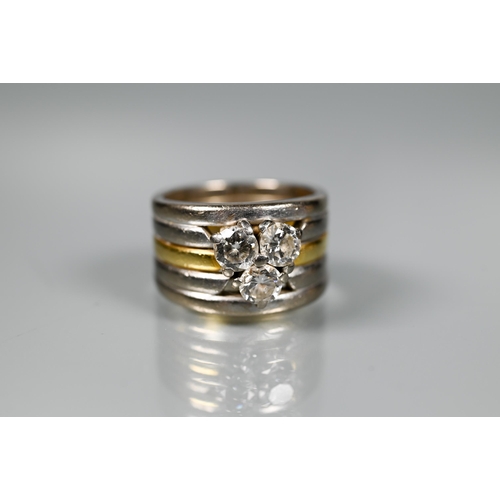 232 - A diamond set ring, the contemporary designed ring formed of a central 18ct gold band with two white... 