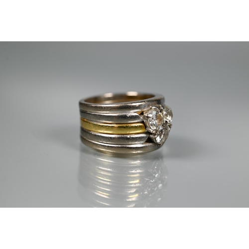 232 - A diamond set ring, the contemporary designed ring formed of a central 18ct gold band with two white... 