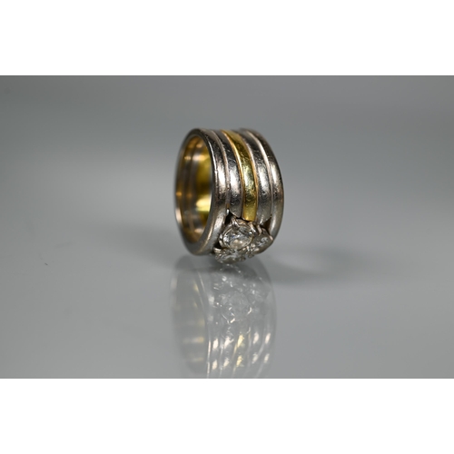 232 - A diamond set ring, the contemporary designed ring formed of a central 18ct gold band with two white... 