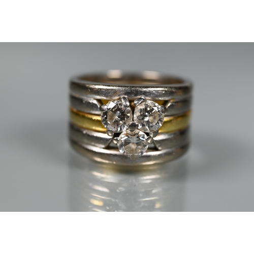 232 - A diamond set ring, the contemporary designed ring formed of a central 18ct gold band with two white... 